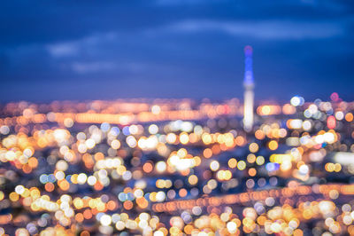 Defocused image of illuminated buildings at night