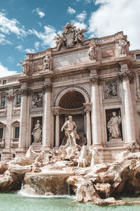 Statue in front of historical building