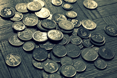 High angle view of coins on table