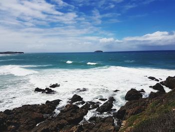 Scenic view of sea against cloudy sky