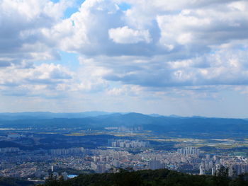 High angle view of buildings in city against sky