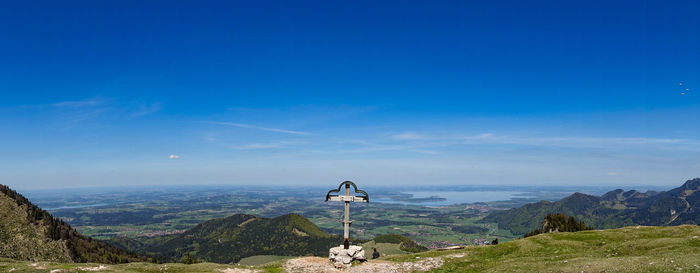 Scenic view of landscape against blue sky