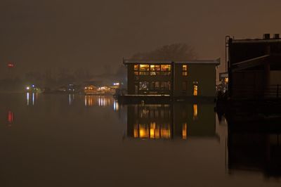 Floating houses in belgrade on sava river in misty night