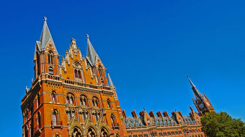 Low angle view of temple building against blue sky