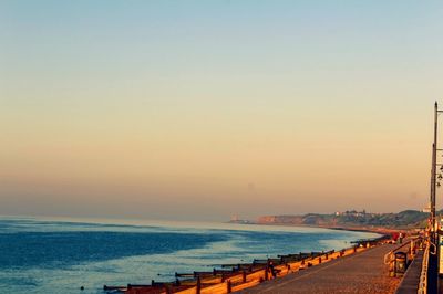 Scenic view of sea against clear sky during sunset