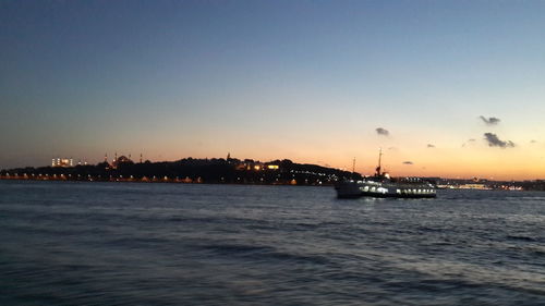 Scenic view of sea against sky at dusk