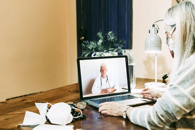 People sitting on table at home