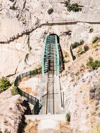 View of staircase leading towards rocky mountains