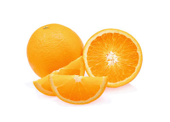 Close-up of orange fruit against white background