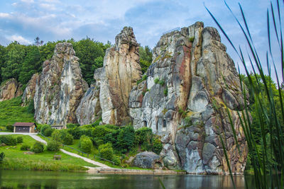 Panoramic view of rocks and plants against sky