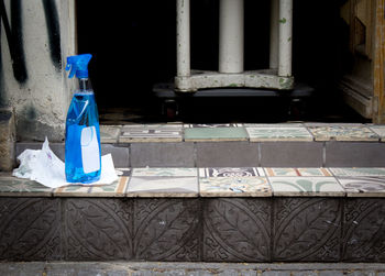 Low angle view of paper house on sidewalk by building