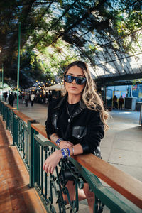 Portrait of young woman in sunglasses