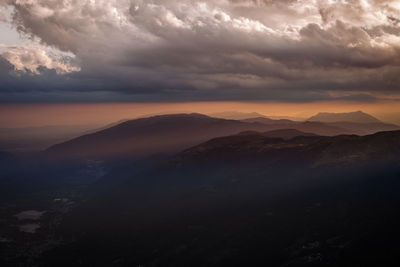 Scenic view of mountains against dramatic sky