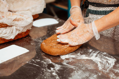 Baker shaping rye dough for bread