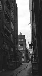 Narrow alley amidst buildings in city