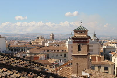 High angle view of buildings in city against sky