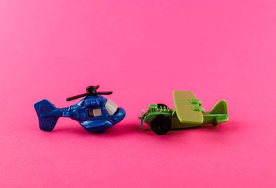 High angle view of toy car on pink background