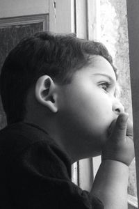 Close-up of boy looking away