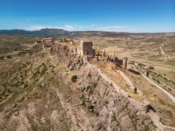 High angle view of medieval castle on top of a hill. castillo de moya, castilla-la mancha, spain