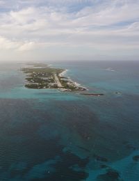 Scenic view of sea against cloudy sky