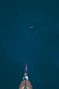 Low angle view of moon against sky at night