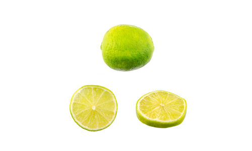 Close-up of lemon slice against white background