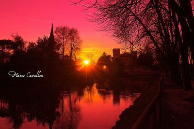 Scenic view of river at sunset