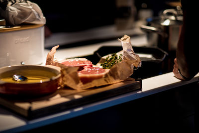 High angle view of meat on cutting board