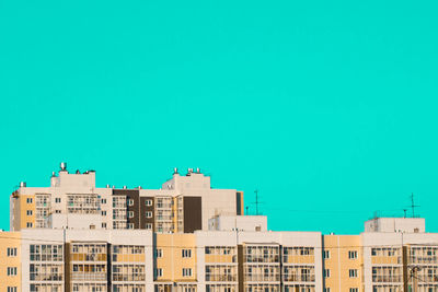 Low angle view of residential buildings against clear sky