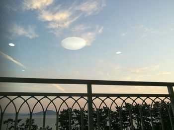 Scenic view of moon against sky at sunset