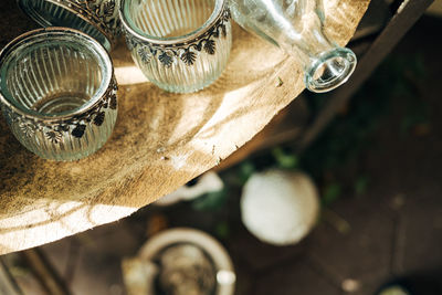 Glass vases in wooden bowl