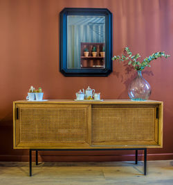 Empty chairs and table against wall at home