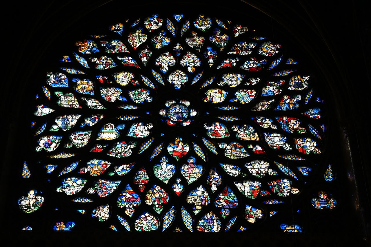 stained glass, pattern, indoors, place of worship, spirituality, religion, belief, design, no people, architecture, window, glass, low angle view, built structure, glass - material, creativity, multi colored, art and craft, floral pattern, ornate, ceiling, architecture and art