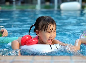 Portrait of boy in swimming pool