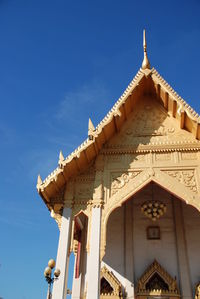 Low angle view of temple against blue sky