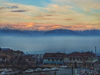 Aerial view of townscape against sky during winter