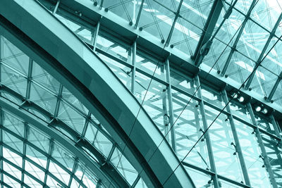 Low angle view of glass ceiling in building