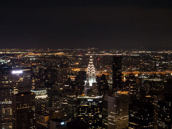 Illuminated modern buildings in city at night