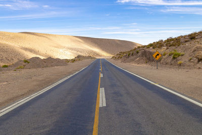 Road in the middle of the desert dunes of the atacama