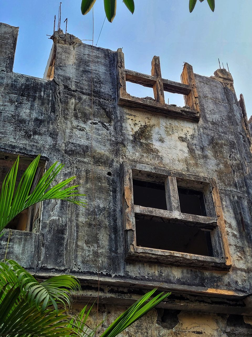 architecture, built structure, ruins, building exterior, history, nature, sky, building, no people, the past, house, plant, old, low angle view, abandoned, wall, outdoors, window, day, tree, ancient history, damaged, travel destinations, village, rundown, tropical climate