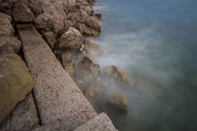 High angle view of rock formation in sea