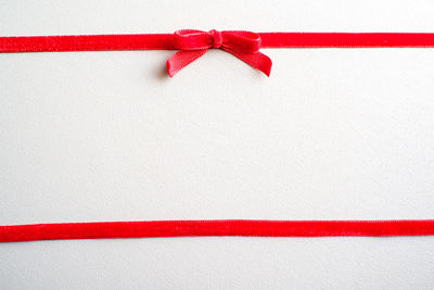 Close-up of red christmas decoration on white background
