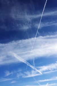 Low angle view of vapor trails in sky