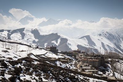 Scenic view of mountains against cloudy sky