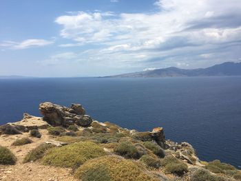 Scenic view of sea against cloudy sky