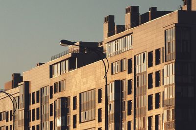 Low angle view of buildings against sky in city