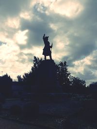 Low angle view of statue against sky