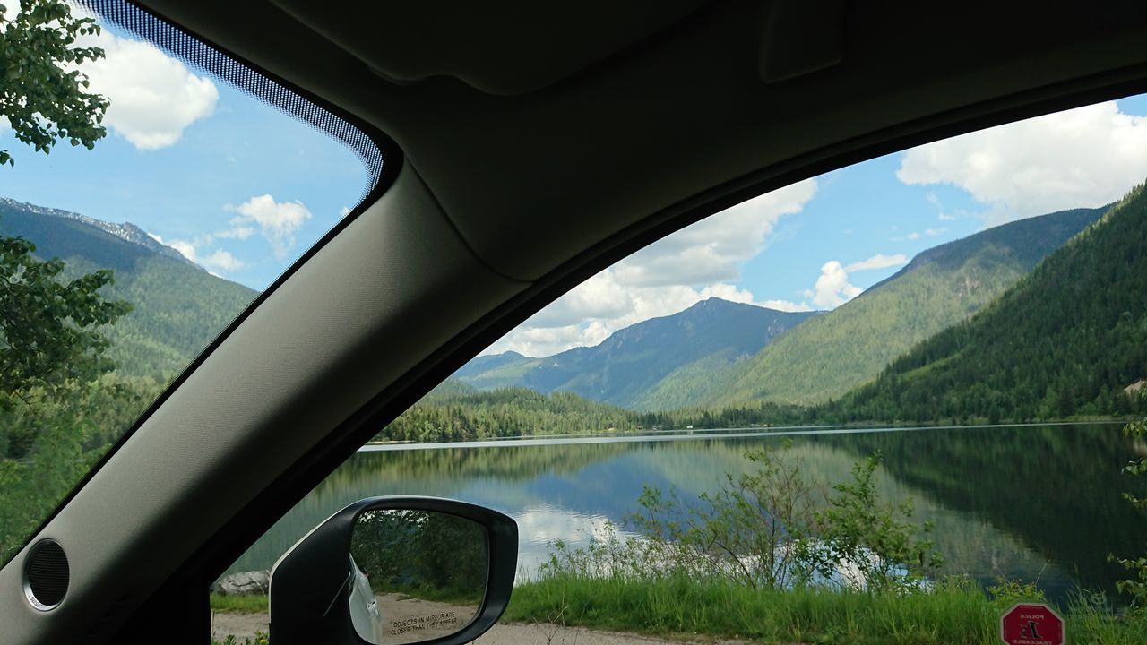 SCENIC VIEW OF MOUNTAINS SEEN FROM CAR