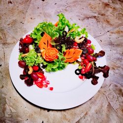 High angle view of fruits in plate on table