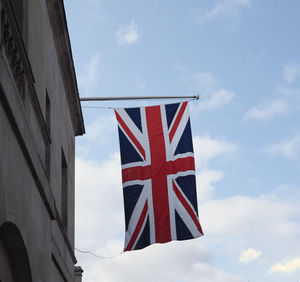 Low angle view of flag against sky